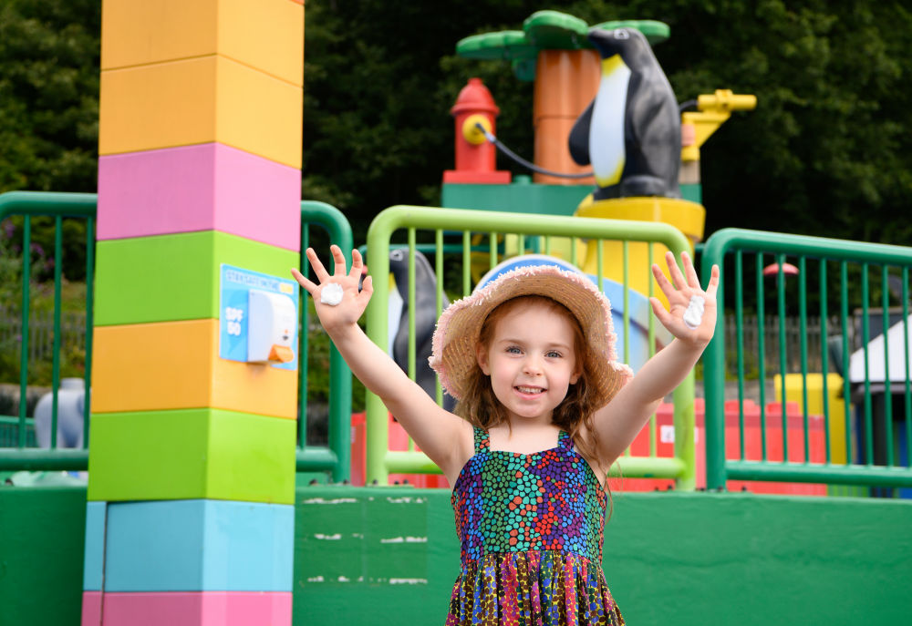 Child using sunscreen at Legoland Windsor Resort