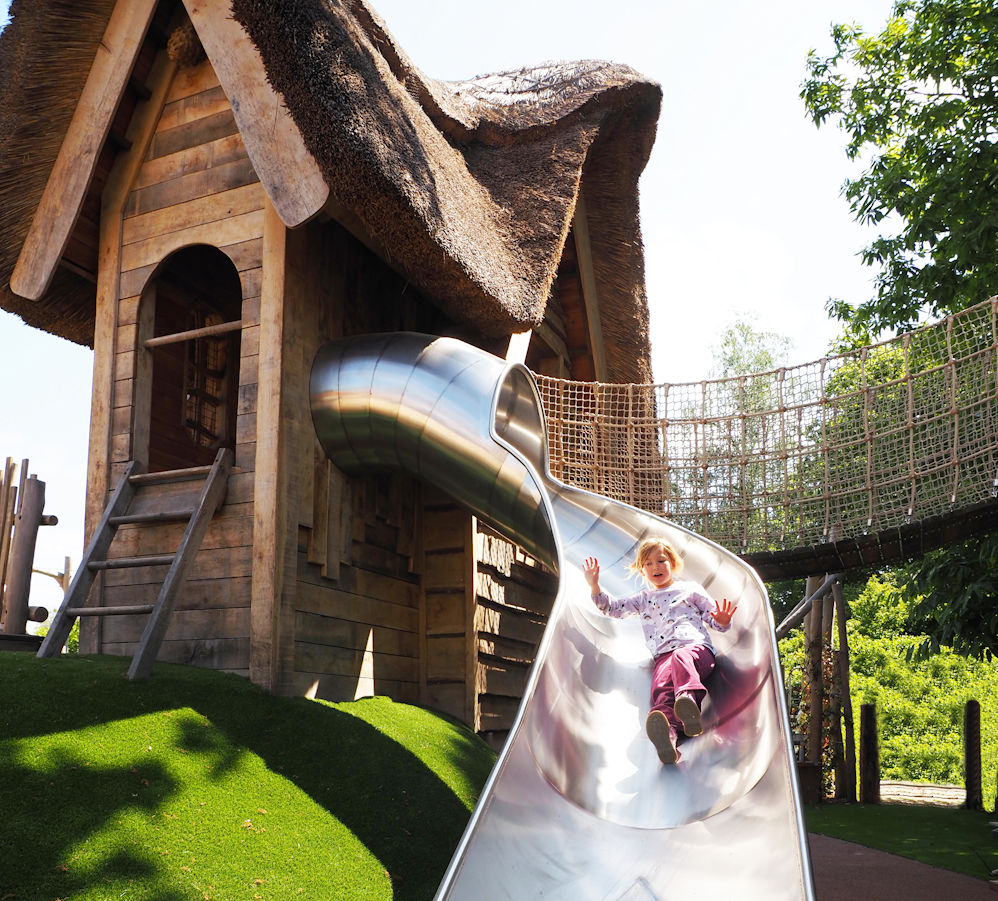 Adventure Play: girl going down a slide