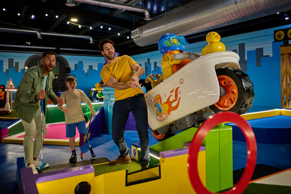 People playing adventure golf at legoland