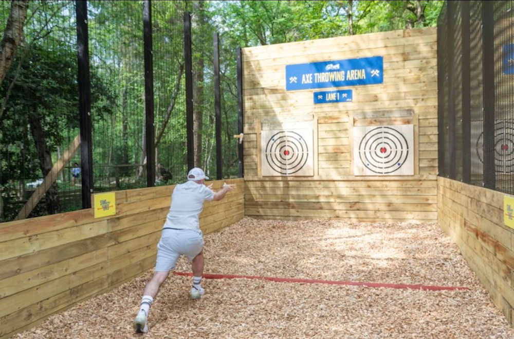 Person axe throwing at Go Ape Bracknell